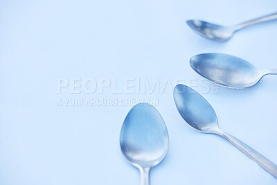 Buy stock photo Kitchen, cutlery and spoon on a table as a group with mockup to represent community, charity or donation. Cooking, metal and space with steel utensils on a surface from above to volunteer or donate