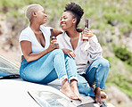 Car, beer and lesbian couple on a road trip love relaxing in nature together in summer drinking alcohol outdoors. Drunk, smile and happy African lgtb girls or women in fun relationship or friendship