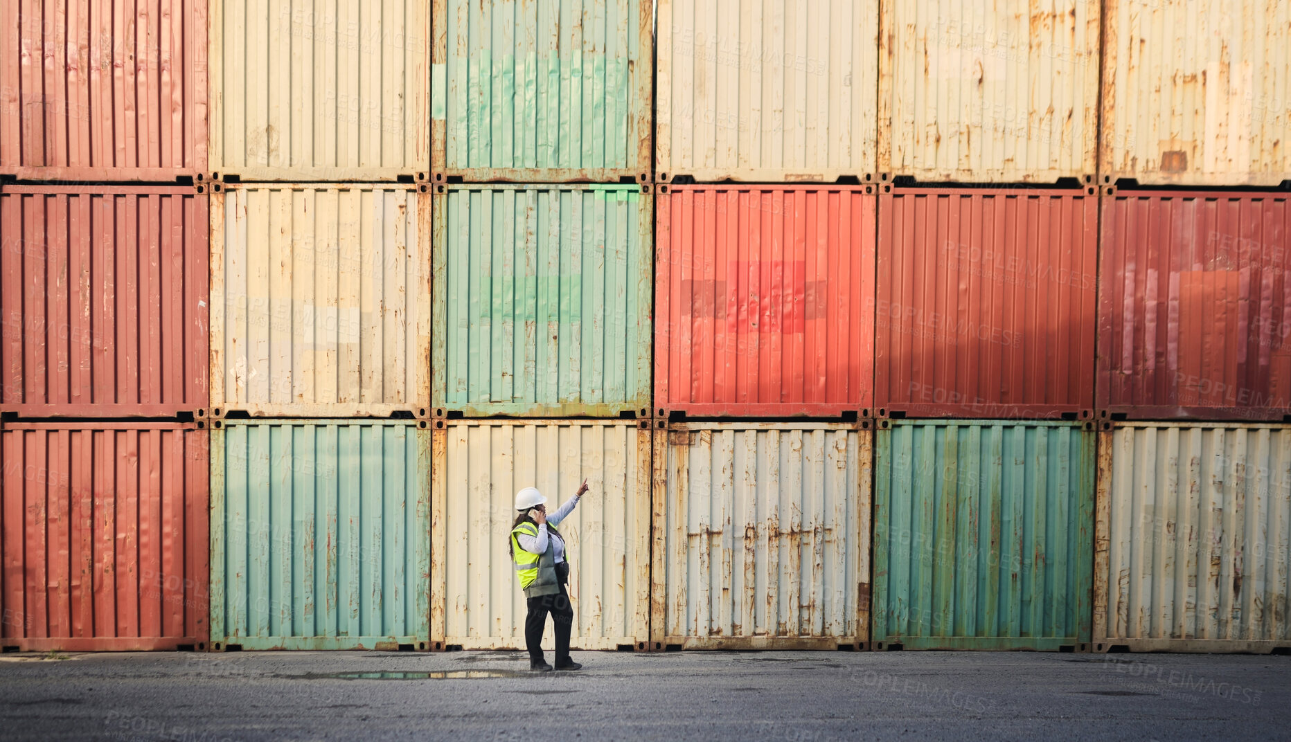 Buy stock photo Logistics, shipping yard and cargo containers manager woman talking on phone for communication for import and export at a shipyard. Female engineer and supply chain worker at a port in South African