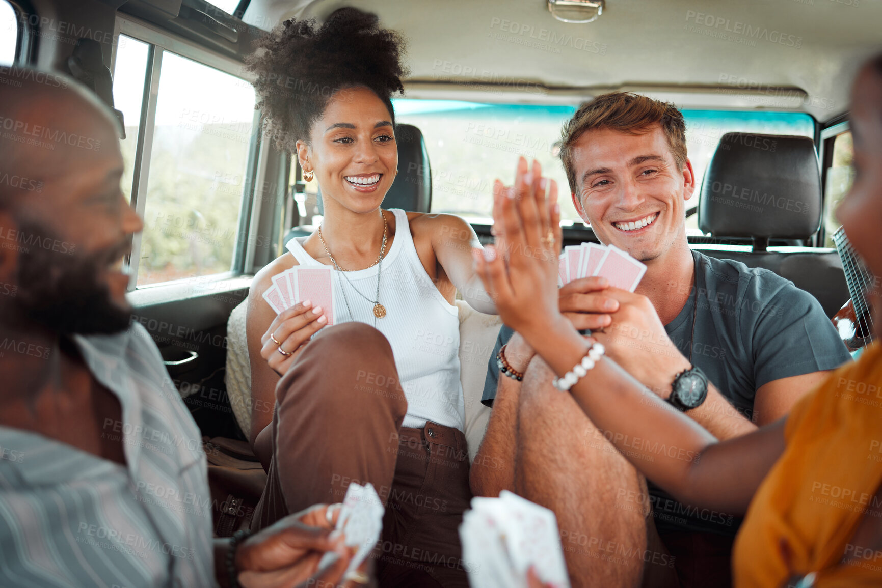 Buy stock photo Card game, car and friends high five on a road trip enjoy holidays, vacation or fun weekend together. Winner, happy and excited girls celebrate playing, winning or victory with a smile in a caravan