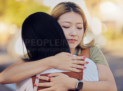 Buy stock photo Woman, friends and love hug in city outdoors together for sorry, support and lesbian couple forgive in street. Asian people, friendship and emotional hugging for grief or sadness in urban city street
