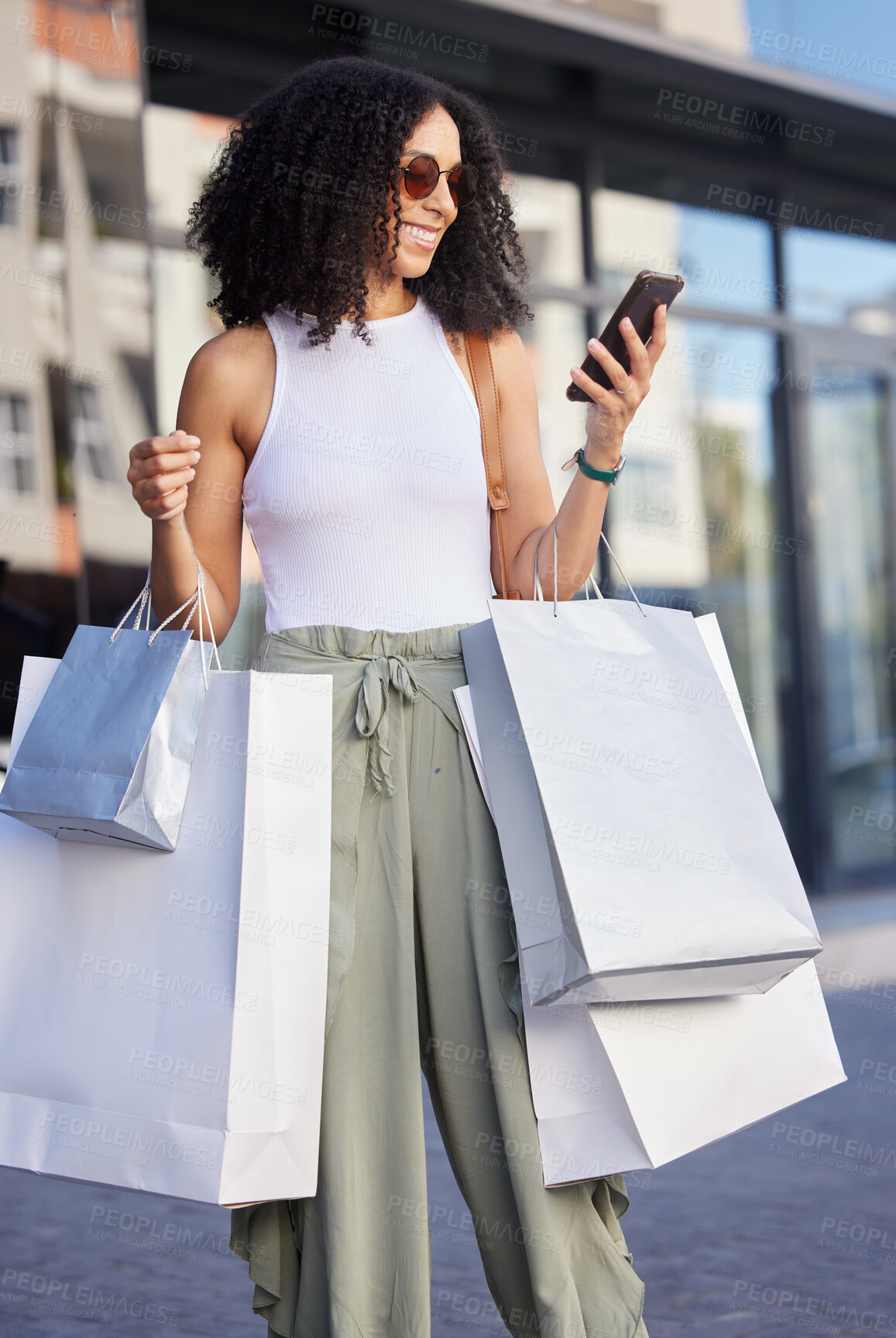 Buy stock photo Shopping, happy customer and woman with phone smile about shopping mall discount and sale. Black woman, shopping bag present and retail store fashion sales of a person on a mobile looking at text