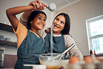 Baking, girl learning and mother with kitchen cooking, flour and home development of a kid and mom. Home, parent care and child making cookies, cake or sweet food with a smile, love and happiness