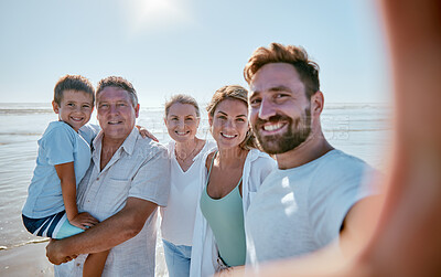 Buy stock photo Family, beach and selfie while on vacation in summer with child, parents and grandparent together for travel update while a smile, love and care. Portrait of men, women and kid at sea for a holiday