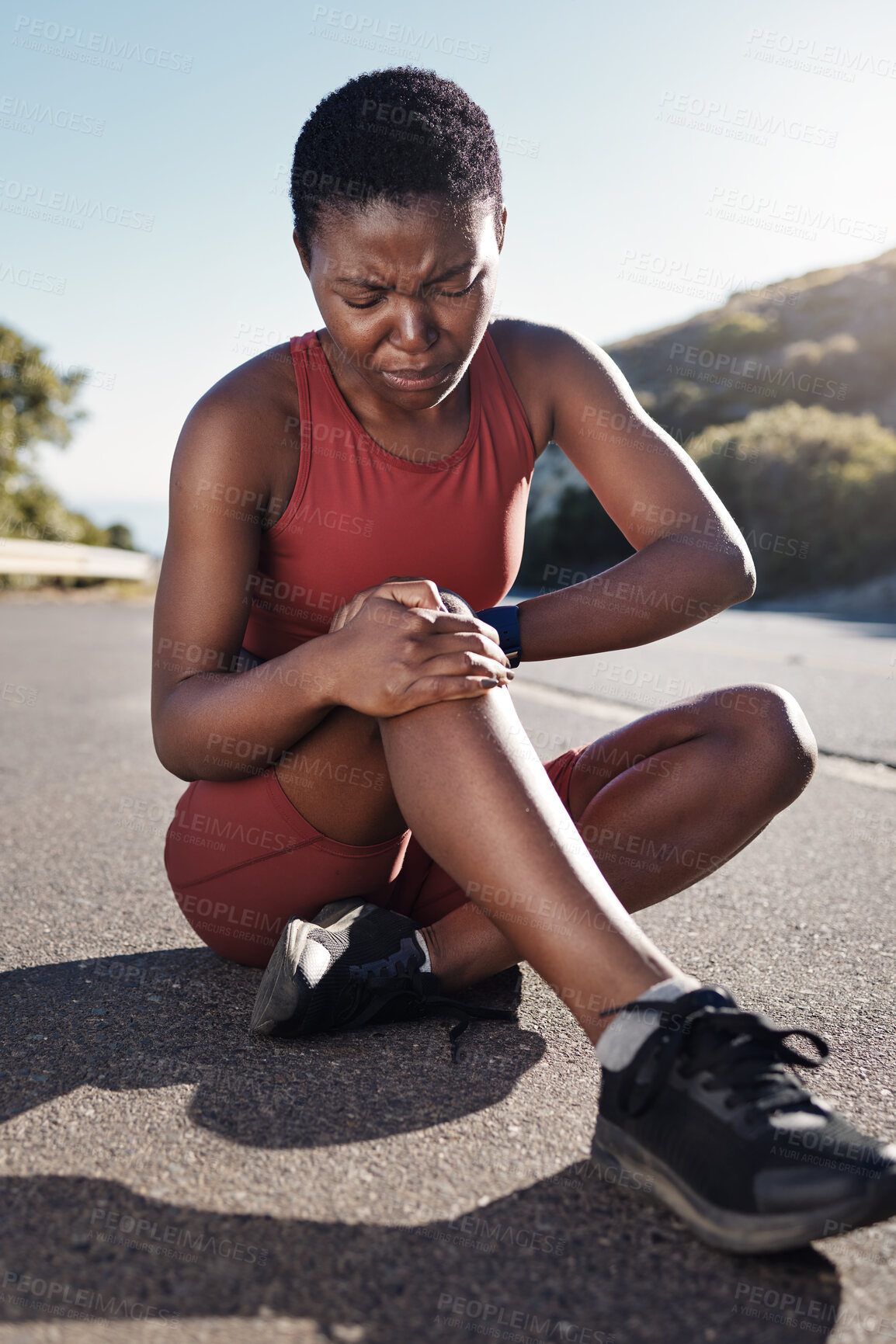 Buy stock photo Black woman, knee and sports injury on asphalt in pain from accident, exercise or run in the outdoors. African American woman suffering leg ache holding painful area, joint or bruise during workout