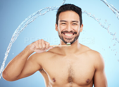 Buy stock photo Water splash, portrait or man brushing teeth in studio with toothbrush for white teeth or dental healthcare. Face, bamboo wood or happy person cleaning or washing mouth with a healthy natural smile