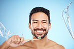 Water splash, portrait or man brushing teeth in studio with toothbrush for white teeth or oral healthcare. Face, tooth paste or happy person cleaning or washing mouth with a healthy dental smile