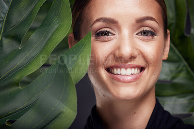 Buy stock photo Beauty, skin and face with leaf and woman, skincare with nature aesthetic, natural cosmetics and facial portrait against studio background. Smile, glow with organic cosmetic treatment and wellness.