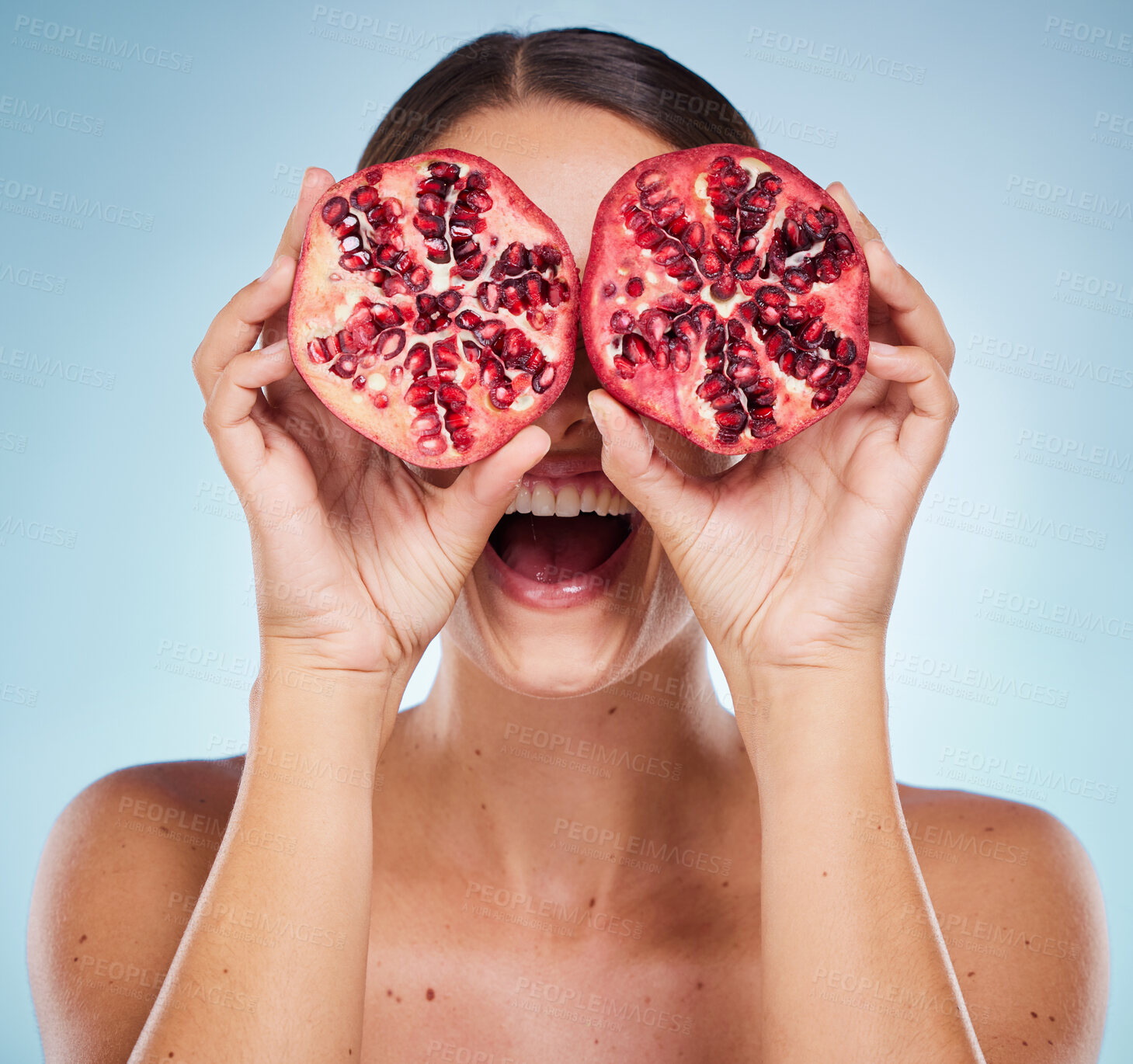 Buy stock photo Pomegranate, beauty and woman hands with natural skincare product, detox and healthy skin with vegan and organic treatment. Happy, fruit and wellness with health for body against studio background.