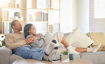 Buy stock photo Senior couple, relax and sofa for hug, thinking or memory of life, love memory or bonding in home living room. Mature man, old woman and embrace on lounge couch for vision, care or support in Florida