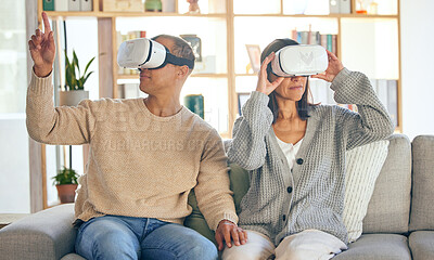 Buy stock photo Virtual reality, 3d and a couple in the interactive metaverse while together on a sofa in the living room of a home. VR, goggles and gaming with a man and woman in their house to relax or video game