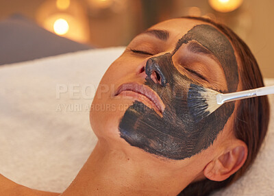 Buy stock photo Spa, woman and charcoal face mask, skincare and luxury for health, wellness and clear skin. Beauty, cosmetics and girl with organic facial, detox and natural care for confidence or treatment to relax