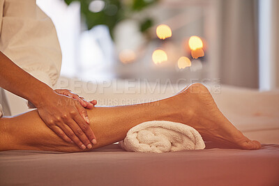 Spa, hands and legs massage for relax, health and wellness at luxury resort. Zen, physical therapy and woman or female therapist massaging leg of person on table for skincare, body care and beauty.