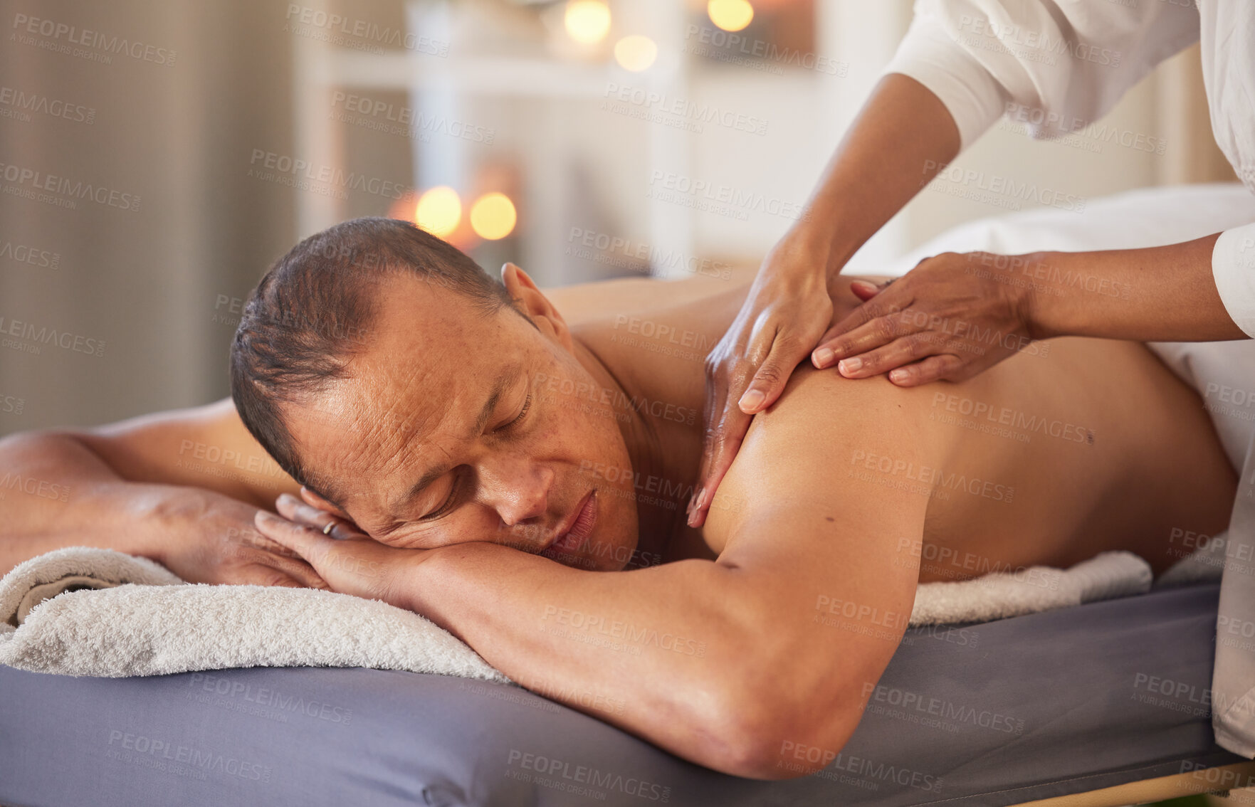 Buy stock photo Spa, relax and hands massage man for health, wellness and stress relief at luxury resort. Zen, physical therapy and female therapist massaging back and arm of male for physiotherapy and body care.