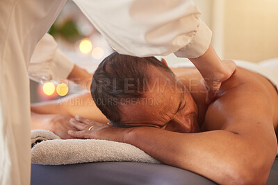 Buy stock photo Spa, man and massage for wellness, luxury and relax for health, peace or lying on table. Male person, rich and self care for healthy lifestyle, zen treatment or grooming for stress relief or holistic