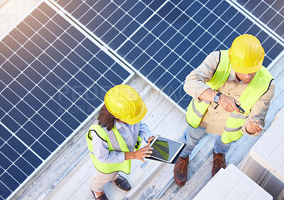 Buy stock photo Top view, teamwork and engineers with tablet on solar roof for maintenance, inspection or installation. Solar energy, renewable energy and man and woman with tech for planning service of solar panels