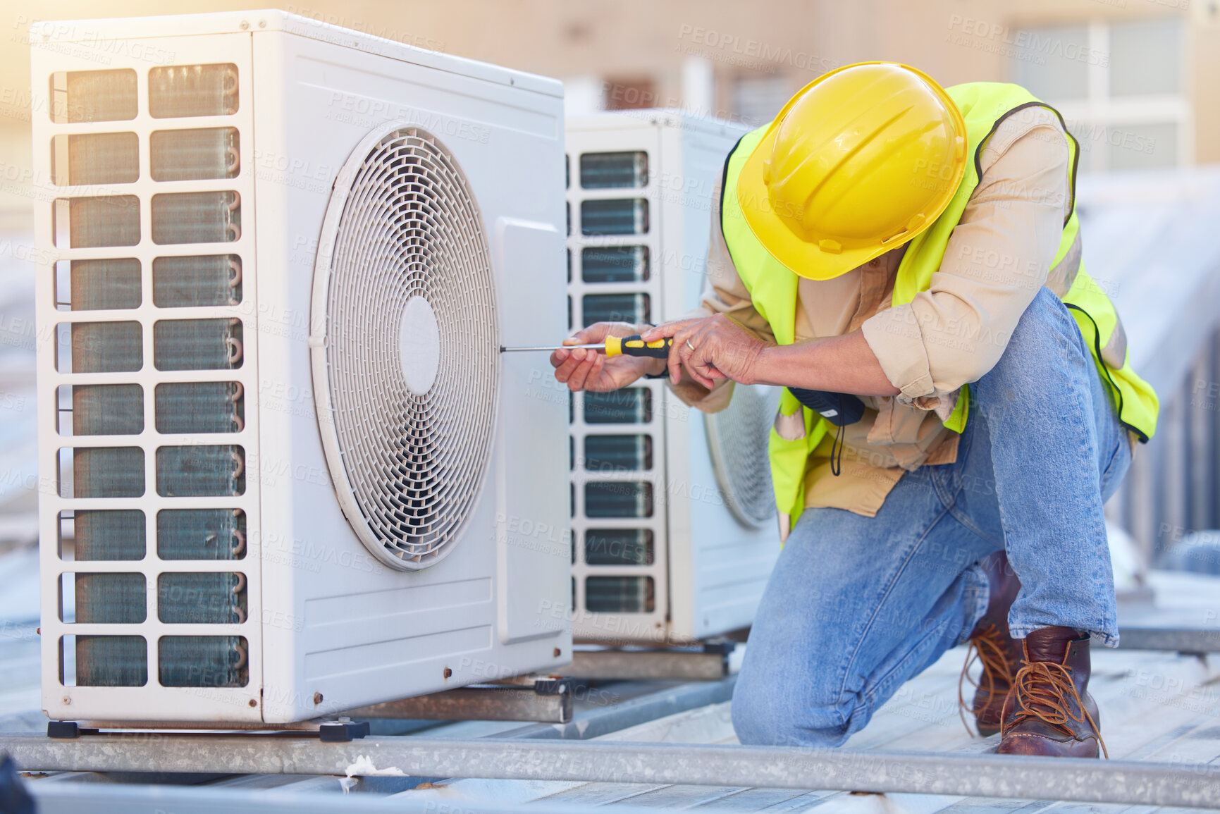 Buy stock photo Air conditioning, technician or engineer on roof for maintenance, building or construction of fan hvac repair. Air conditioner, handyman or worker with tools working on a city development project job