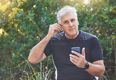 Buy stock photo Fitness, phone or old man listening to music, radio or motivational audio for running exercise or workout. Wellness, relaxing or senior person streaming a podcast or song in headphones in nature park