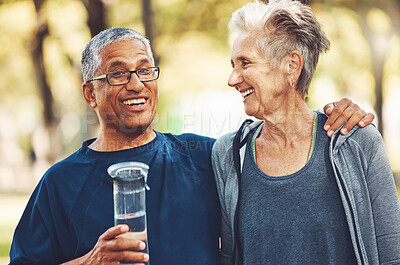 Buy stock photo Exercise, senior couple in park and water bottle for training, workout and smile. Mature man, elderly woman and hydration for practice, cardio and energy for wellness, health and fitness in nature.