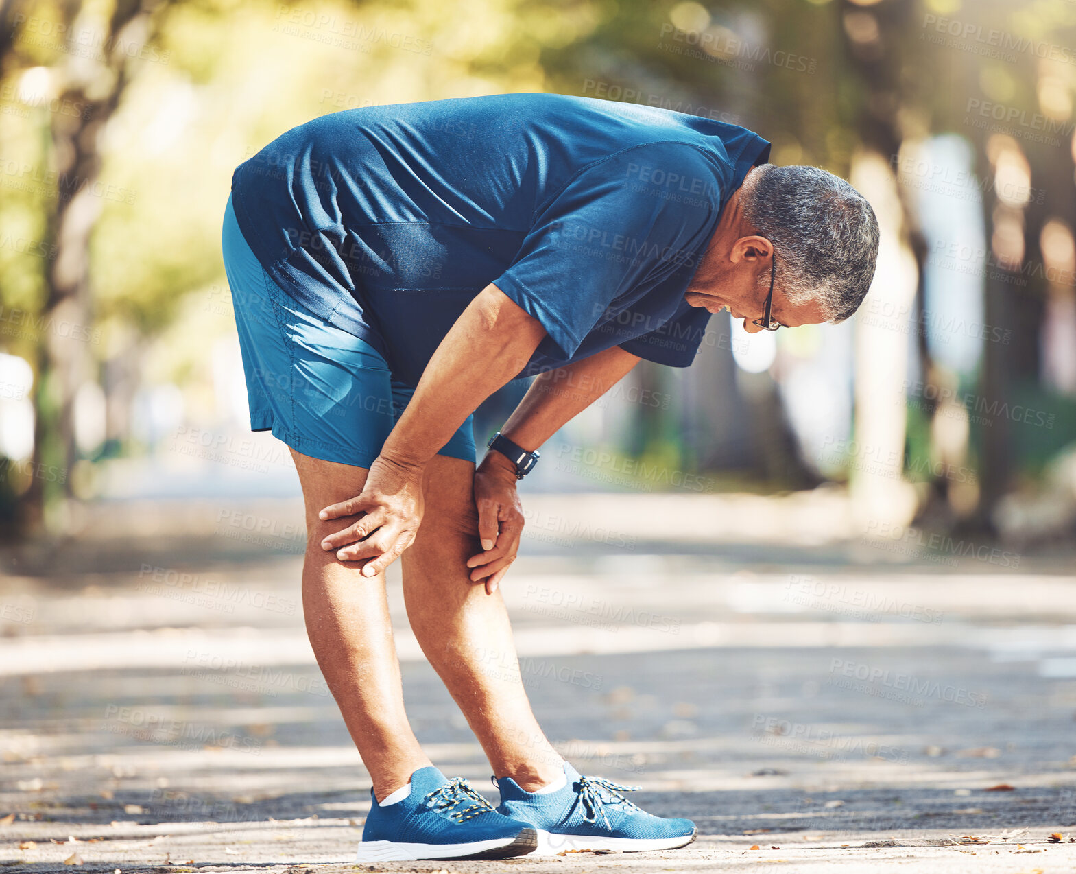 Buy stock photo Exercise, senior man and tired outdoor, breathing and balance for wellness, health and retirement. Elderly male, athlete and resting for workout, runner and exhausted for fitness, training and cardio