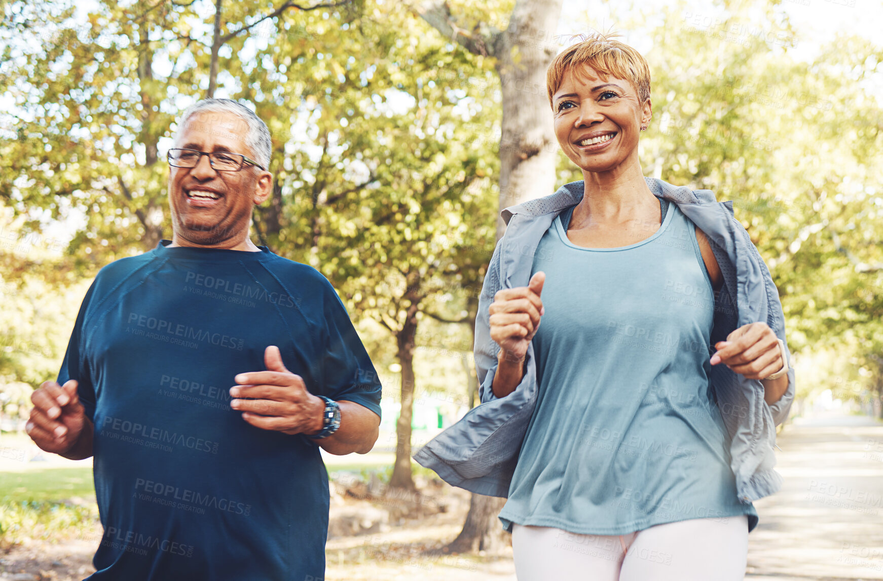 Buy stock photo Senior runner couple, park and fitness with smile, teamwork or motivation for wellness in summer sunshine. Happy elderly man, woman and running team by trees for exercise, health or outdoor workout
