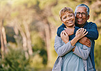 Nature, love and portrait of a senior couple hugging in a garden while on romantic outdoor date. Happy, smile and elderly people in retirement embracing in park while on a walk for fresh air together