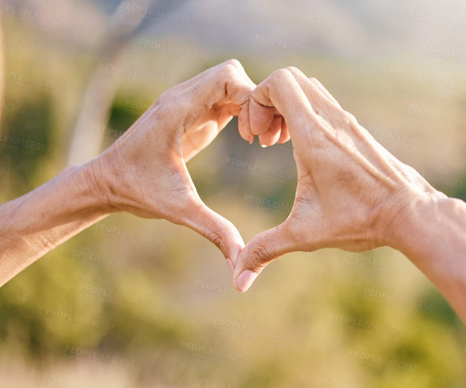 Buy stock photo Hands, heart and woman with a love symbol in nature in garden while on adventure, vacation or trip. Freedom, romance and hand romantic gesture with shape emoji in the park, forest or woods on holiday