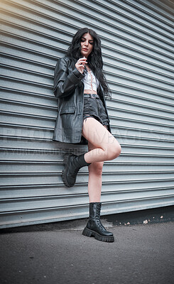 Buy stock photo Young woman smoking, fashion and streetwear with gen z punk style, outdoor and trendy, edgy in urban city. Youth, focus and beauty with rock aesthetic, fashion model in designer clothes in London