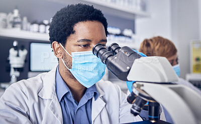 Buy stock photo Science, covid and black man in laboratory with microscope and face mask, motivation in future vaccine development. Healthcare, scientist or pharmacist with ideas and innovation in medical research.