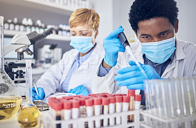 Buy stock photo Science, innovation and covid, teamwork in laboratory with test tube and face mask, motivation in future vaccine or cure development. Healthcare, black man and scientist woman doing research in lab.