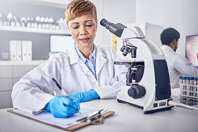 Buy stock photo Senior black woman, research or scientist writing a science report in a laboratory for medical data analysis. Healthcare, focus or doctor working on chemistry paperwork, documents or development 