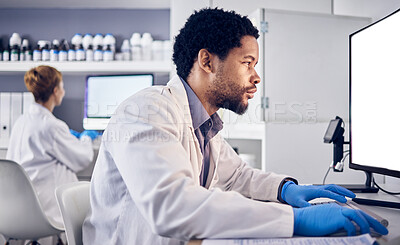 Buy stock photo African scientist man, mock up and computer in research, reading or focus for goals in lab. Black man, science or laboratory with blank desktop pc for vision, healthcare or pharmaceutical mockup