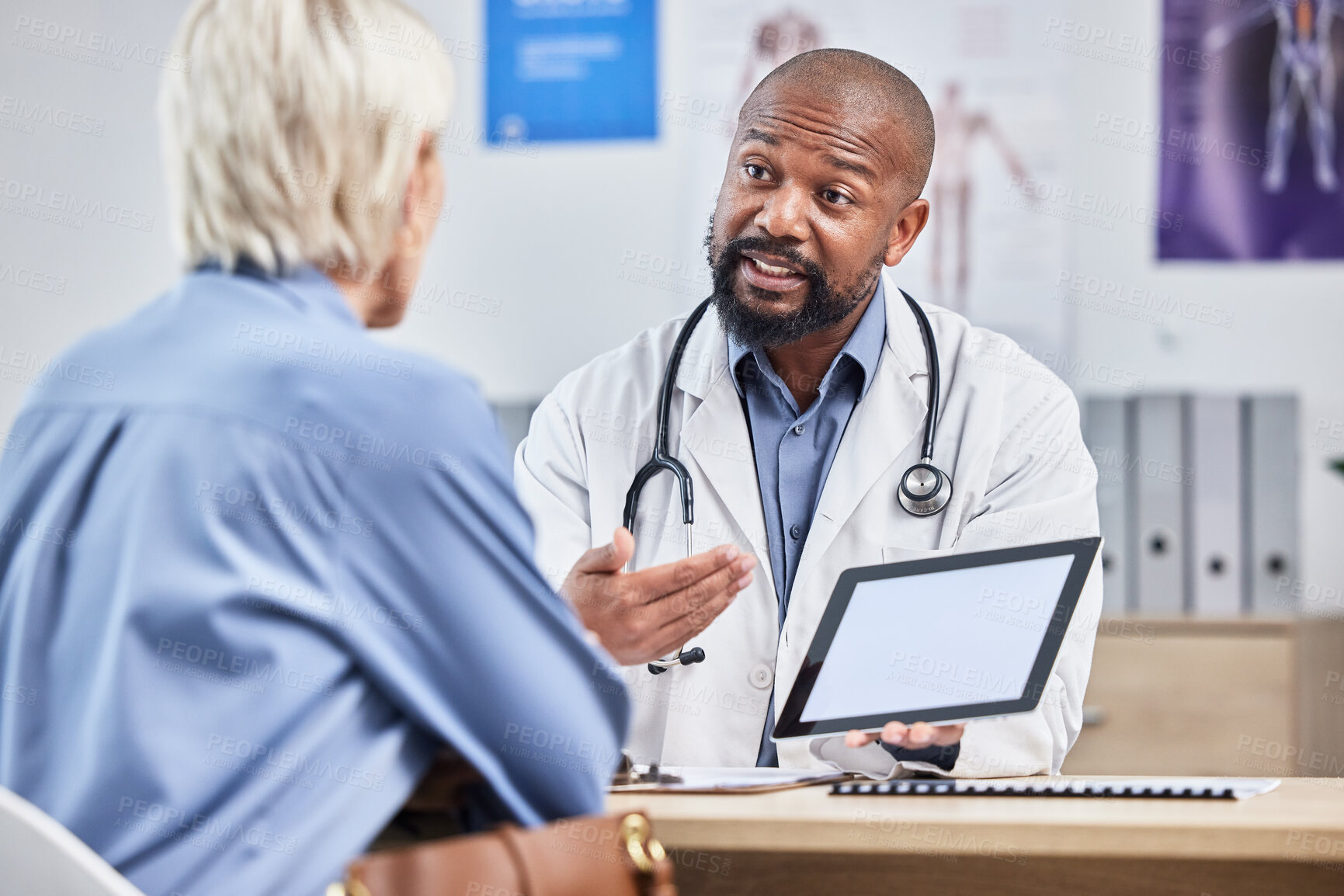 Buy stock photo Doctor consultation, tablet mockup and patient consulting black man about medical results, healthcare report or hospital insurance. Mock up product placement, digital tech and advice for senior woman