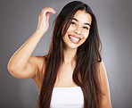 Hair care woman, smile and studio portrait for healthy cosmetic treatment, style and happy by backdrop. Model, hair health and natural shine with self care, self love and glow by studio background