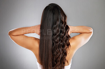 Buy stock photo Woman back, curly or straight hairstyle on gray studio background for keratin treatment marketing, waves product advertising or grooming. Model, brunette color or healthy growth texture in wellness