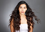 Hair, hair care and woman, face and beauty, glow and shine with keratin treatment. Cosmetic mockup, waves and texture with hair style with studio background. Wellness, self care portrait and growth.