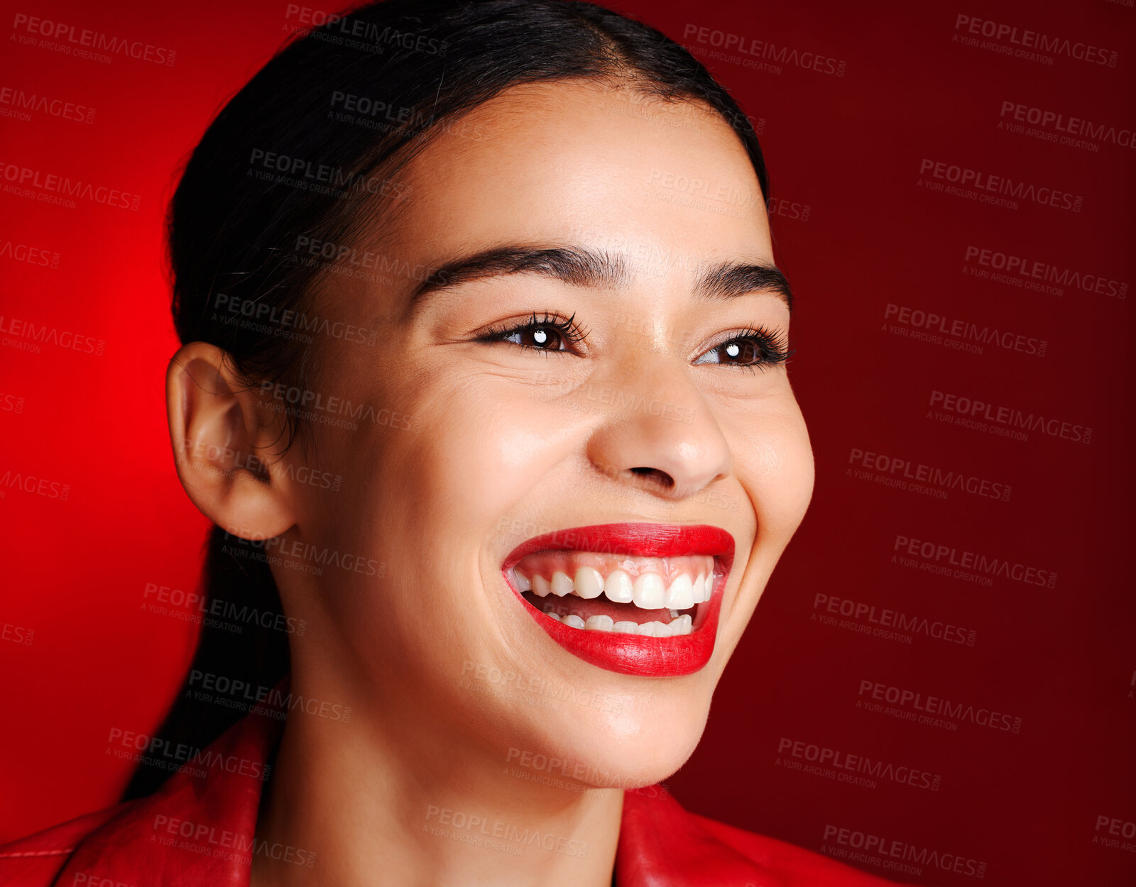 Buy stock photo Woman, makeup and smile with lipstick in studio for beauty, cosmetics or self love with glow face. Model, natural cosmetic shine or skin wellness for self care, health and aesthetic by red background