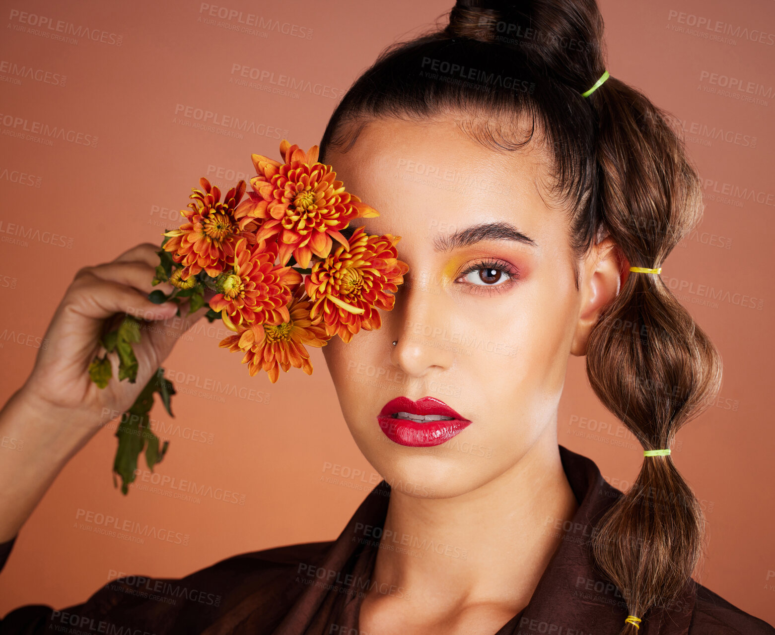 Buy stock photo Makeup, beauty or woman in studio with flowers for art fashion and natural facial cosmetics for self care. Face portrait, orange plants or girl model with red lipstick, eyeshadow and glowing skin 