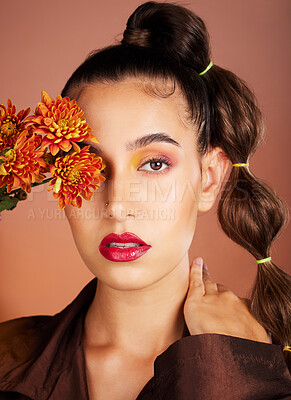 Buy stock photo Makeup, beauty or woman in studio with flowers for art fashion and natural facial cosmetics for self care. Face portrait, orange plants or girl model with red lipstick, eyeshadow and glowing skin 