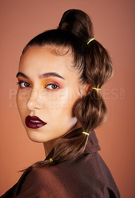 Hair, beauty with hair care and woman, makeup and cosmetics with lipstick, eye shadow and microblading against studio background. Portrait, long hair and healthy growth with glow and shine.