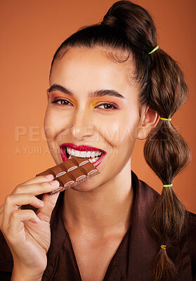 Buy stock photo Chocolate, beauty and portrait girl eating sugar candy, sweets or dark chocolate dessert for stress relief. Skincare, facial cosmetics makeup and model woman face with cacao product for antioxidants