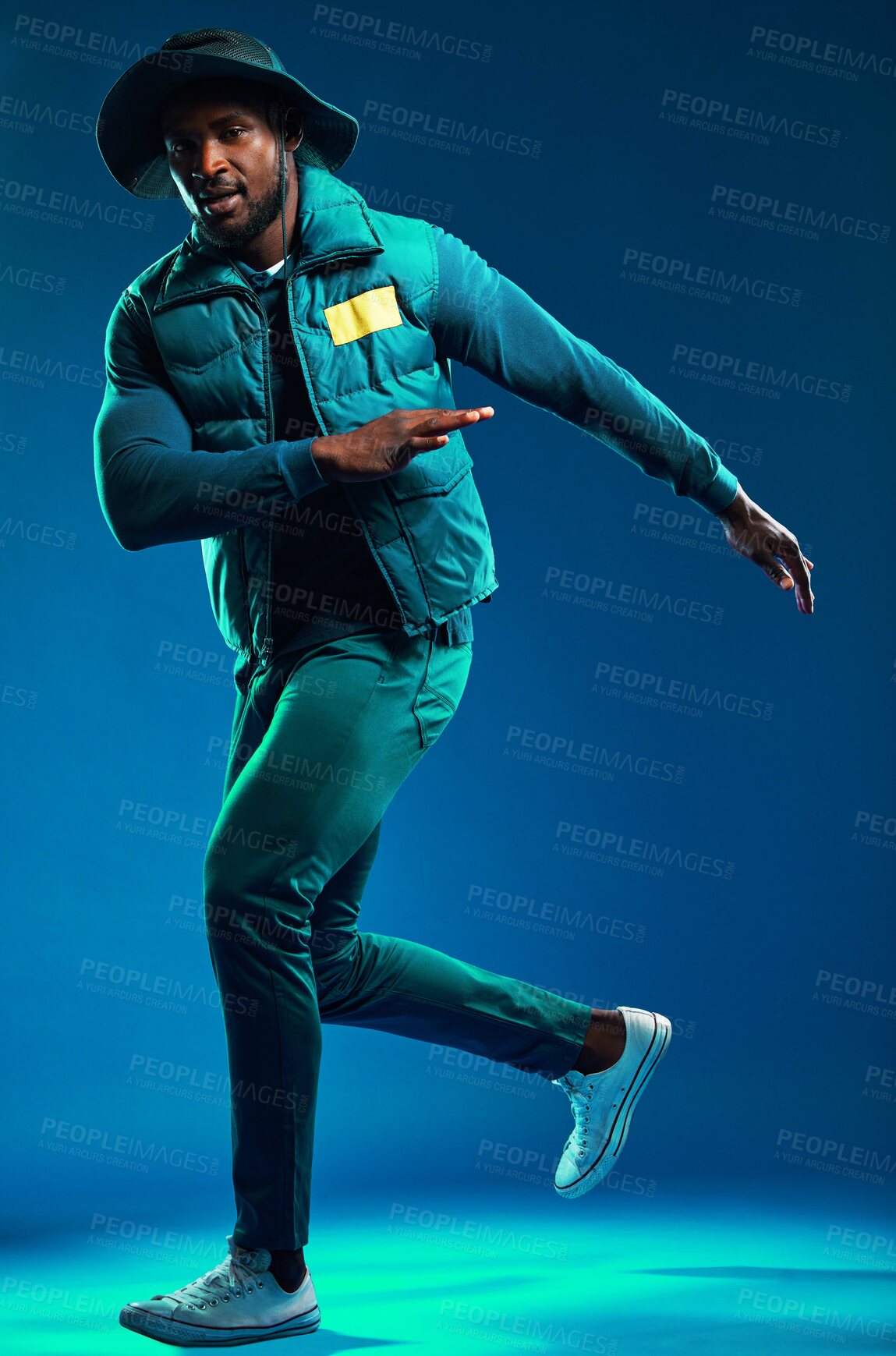 Buy stock photo Fashion, neon and portrait of black man on blue background with cool, trendy and stylish outfit. Creative style, urban clothing and male fashion model in studio with designer, modern and edgy clothes