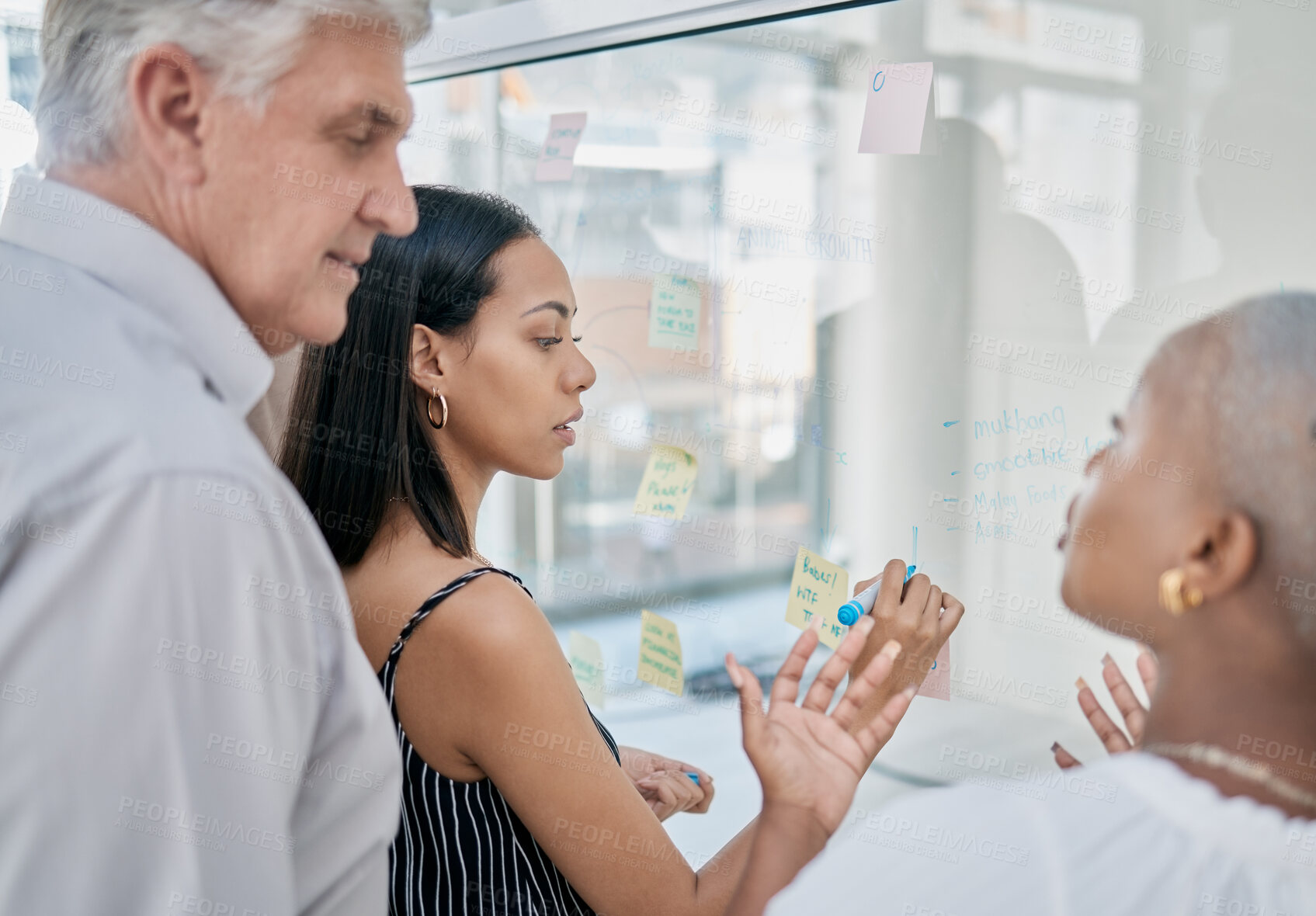 Buy stock photo Innovation, meeting or woman writing on a sticky note planning a startup project on glass board in office building. Focus, leadership or creative business people working on strategy ideas or solution