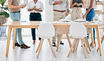 Meeting, collaboration and table with a business team standing in the boardroom for strategy or planning. Corporate, teamwork and documents with a man and woman employee group in a training workshop