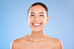 Face portrait, beauty skincare and woman in studio isolated on a blue background. Makeup, cosmetics and young female model with healthy, glowing and flawless skin after luxury spa facial treatment.