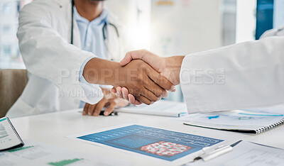 Buy stock photo Closeup handshake, doctors and agreement for documents, research or health in hospital to stop virus. Doctor, shaking hands and motivation for healthcare service, wellness or teamwork goal in clinic