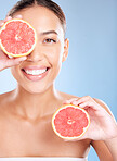 Beauty, grapefruit and woman with face and natural cosmetic care, facial and glow with vegan product against studio background. Skincare, healthy skin and wellness with fruit, hands and cosmetics.
