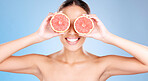 Grapefruit, skincare and wellness of a woman with fruit, skincare smile or healthcare face glow. Model, happy or girl  with fruits for health, cosmetic and healthy aesthetic facial beauty with food