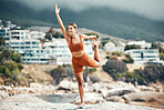 Yoga, balance and fitness with woman at the beach, pilates and zen in nature with exercise and body care outdoor. Workout by the ocean, stretching and peace with mindset and motivation for wellness.