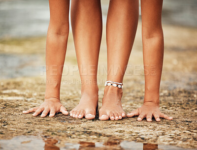 Buy stock photo Woman feet, sand and yoga stretching at beach for health, wellness and fitness in nature. Closeup hands, legs and flexible girl relax in pilates exercise at sea, ocean and workout, balance and body